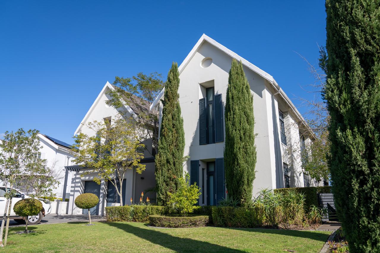 Completed modern gabled home with cypress trees, Val de Vie